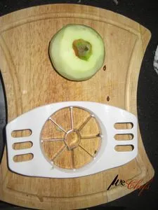 Apple slicer and pealed apple (opens in a new tab)