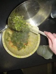 Adding sauted celery, onions and pepper to the bowl (opens in a new tab)